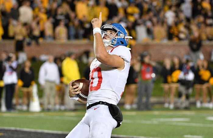 Mississippi Rebels quarterback John Rhys Plumlee (10) celebrates after scoring during the second half against the Missouri Tigers at Memorial Stadium/Faurot Field. Mandatory Credit: Denny Medley-USA TODAY Sports